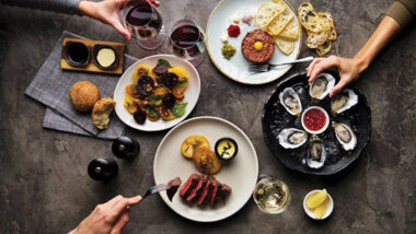 Black Hide by Gambaro Food and Table spread iwth Oysters and Steak